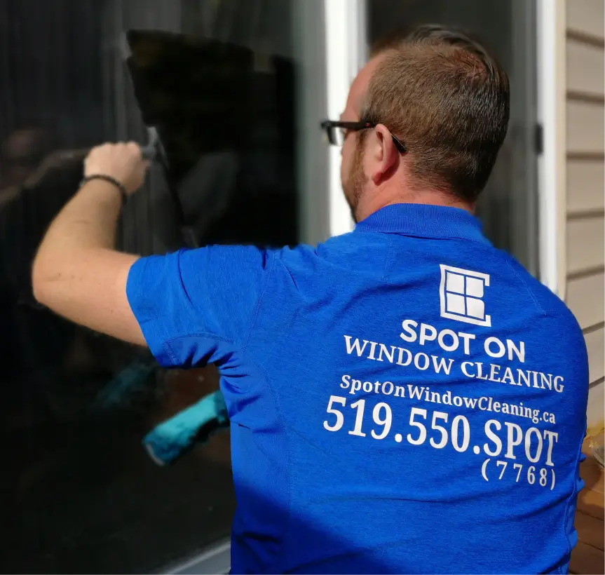 Window cleaning a London house